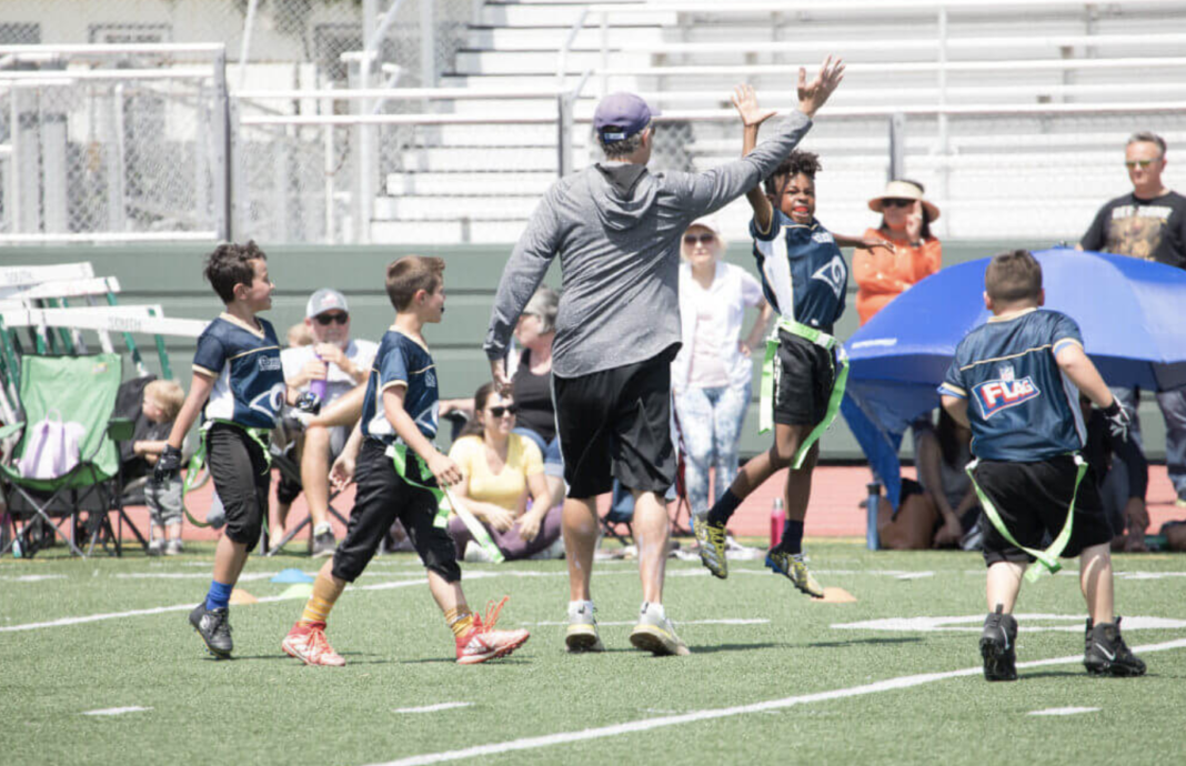 PHOTO: Bruce Feldman coaching his kid courtesy of The Athletic